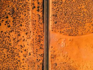 Aerial view of desert land and road access for a due diligence survey before purchasing property in Kingman Arizona.
